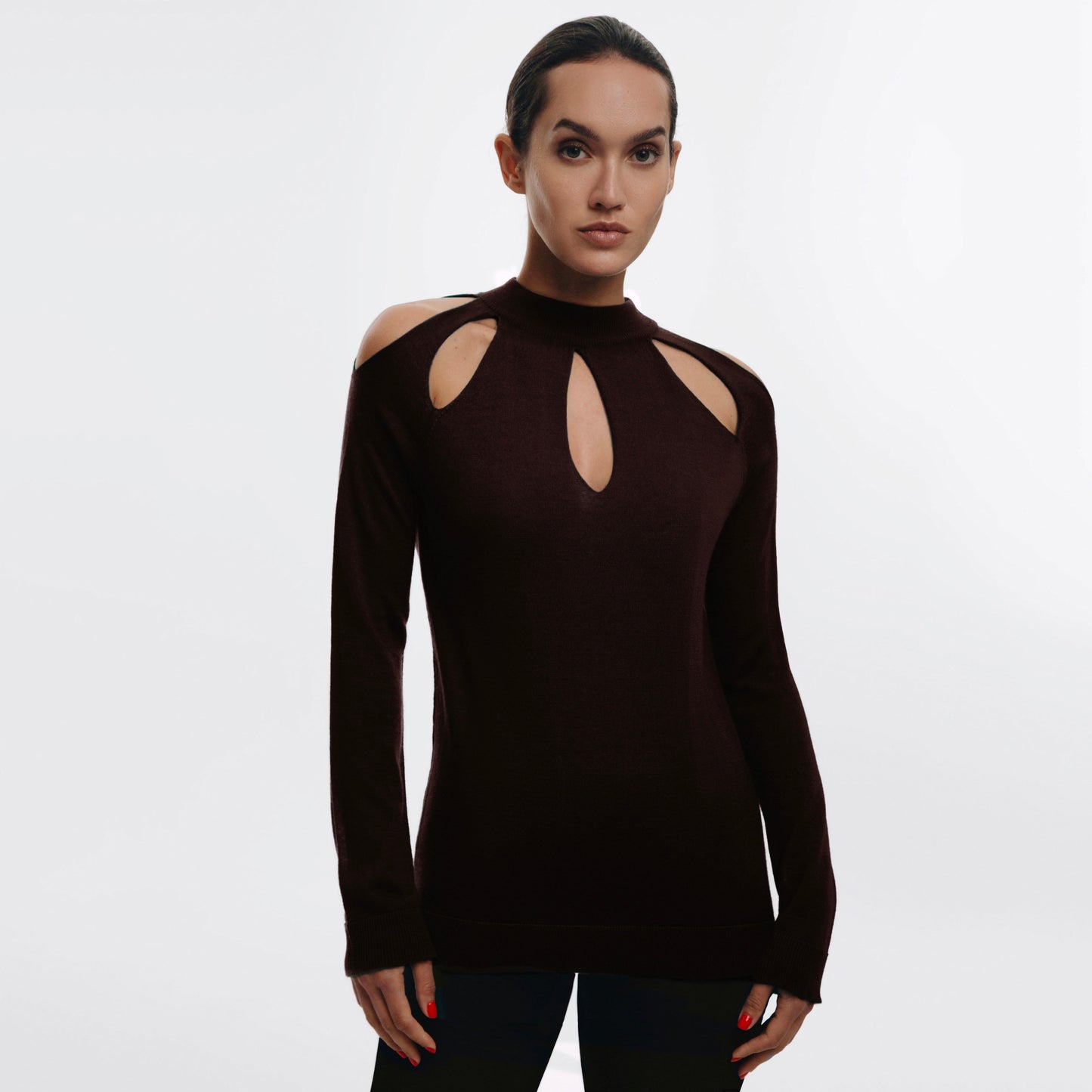 Woman wearing a brown long-sleeve Cashmere sweater with cut-out design on the front