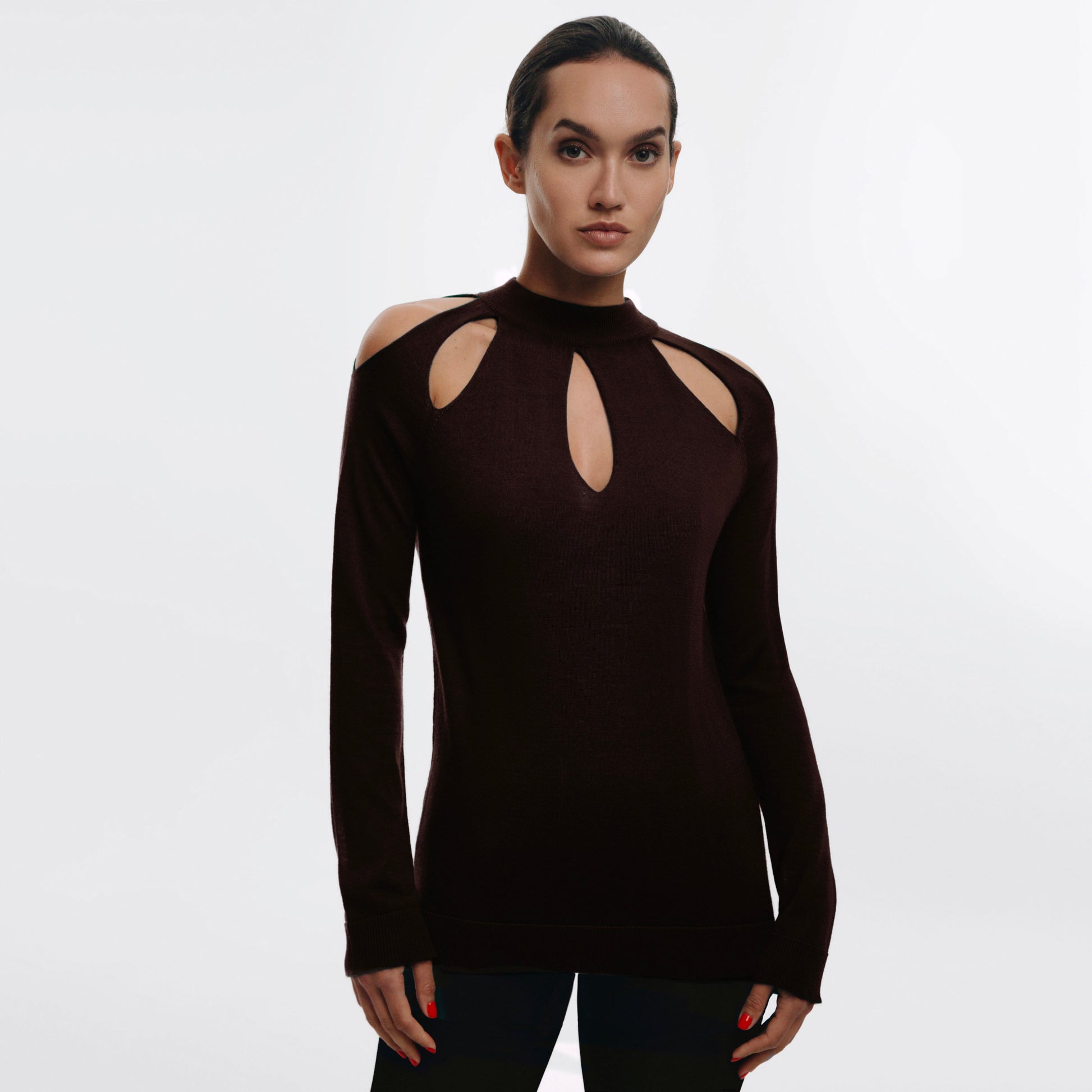 Woman wearing a brown long-sleeve Cashmere sweater with cut-out design on the front